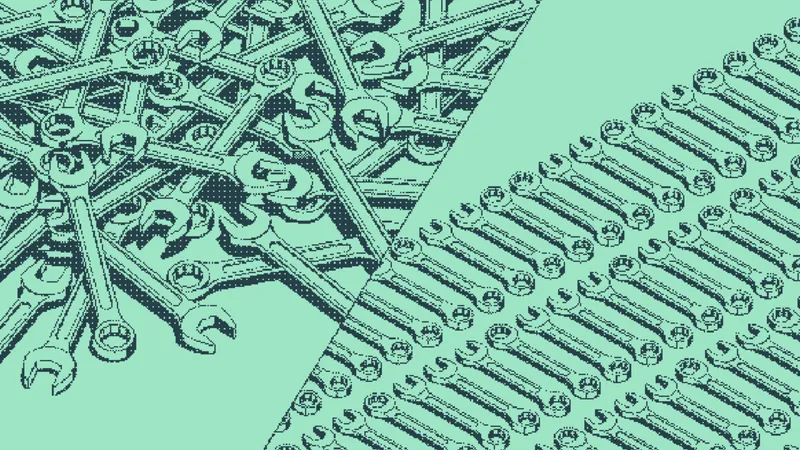 Wrenches tangled in a heap beside wrenches lined up in neat rows