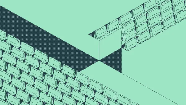 Two brick walls meeting at a corner around a dark triangular gap