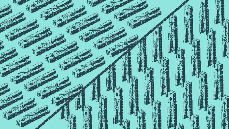 Clothespins scattered loosely beside clothespins clipped in tidy rows